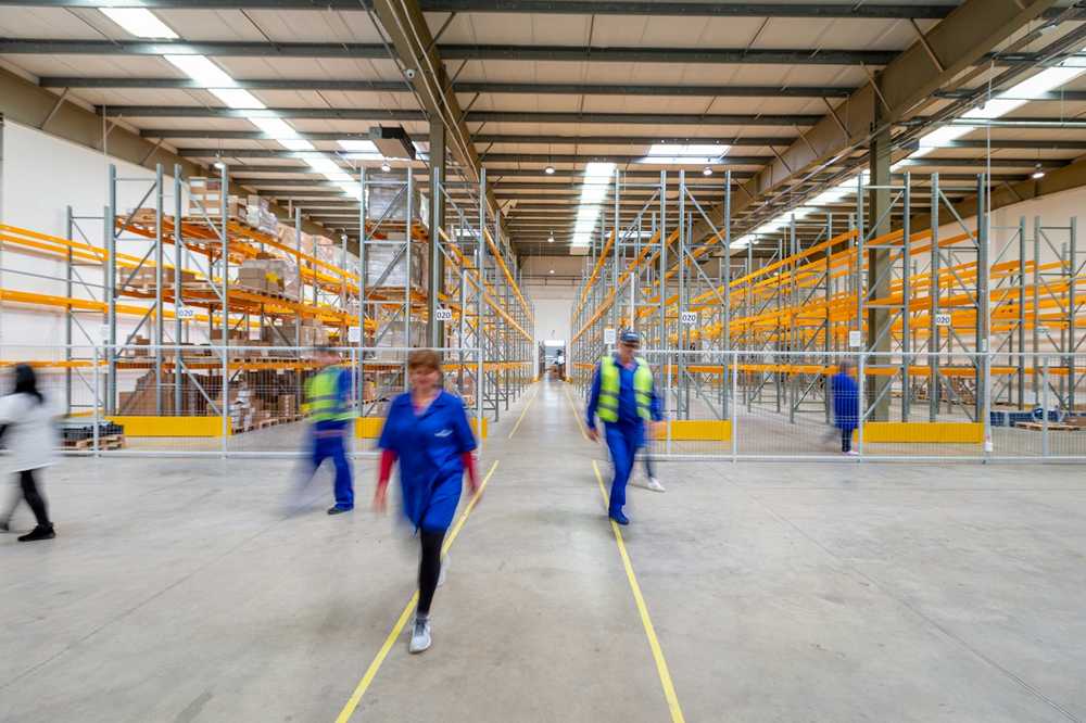 A labour hire worker in a warehouse aisle